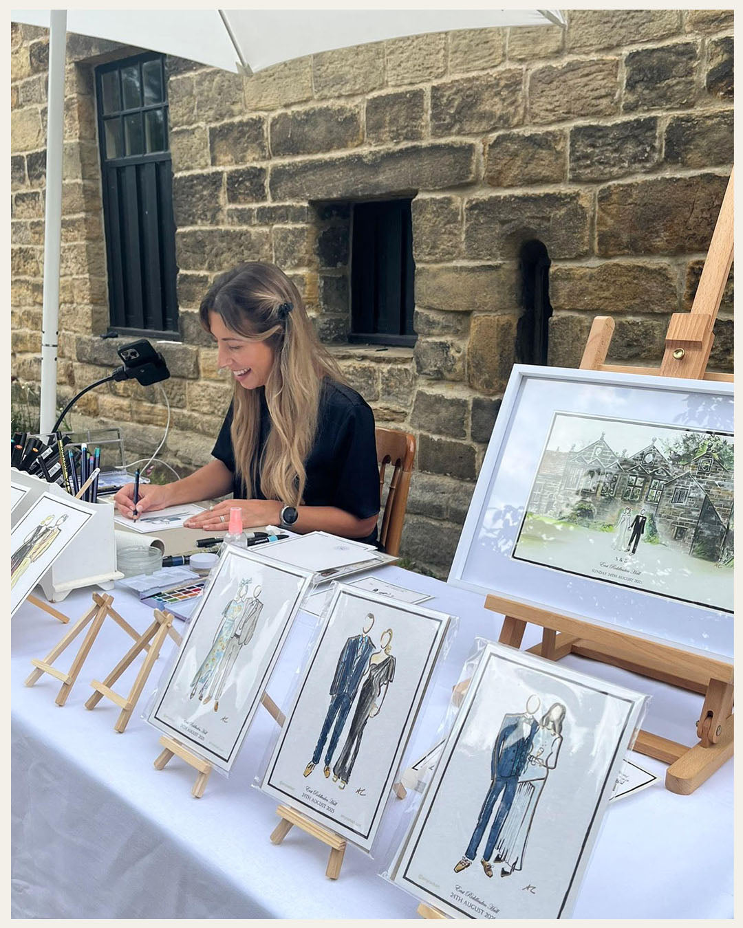 Amy creating live guest illustrations at a wedding